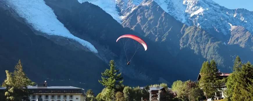 Traveler enjoying breathtaking mountain views surrounded by alpine landscapes and hiking trails.